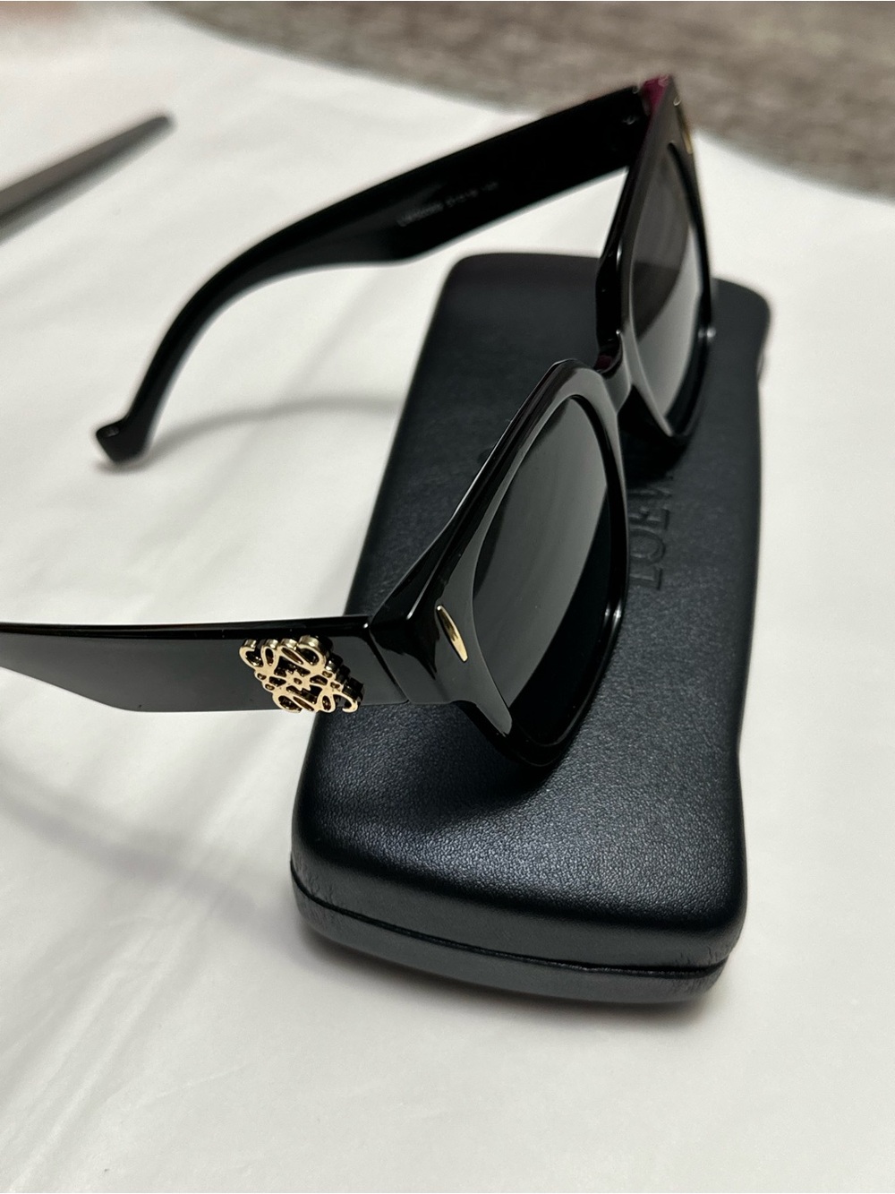 Black Designer Sunglasses with Gold Accent and branded case